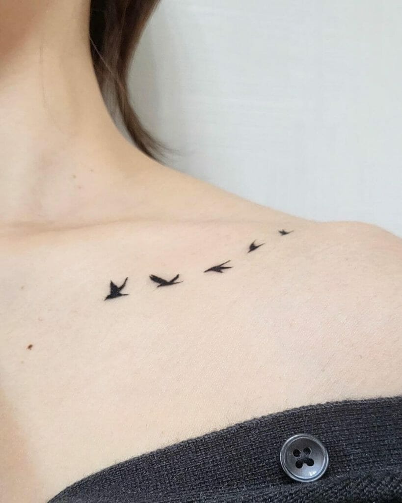 Flock Of Birds Flying On The Collar Bone Tattoo
