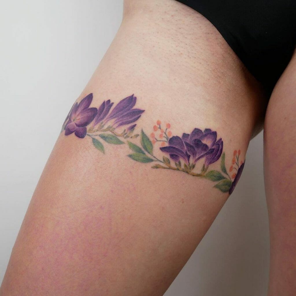 Freesia Flower Upper Thigh Wrap Around Tattoo