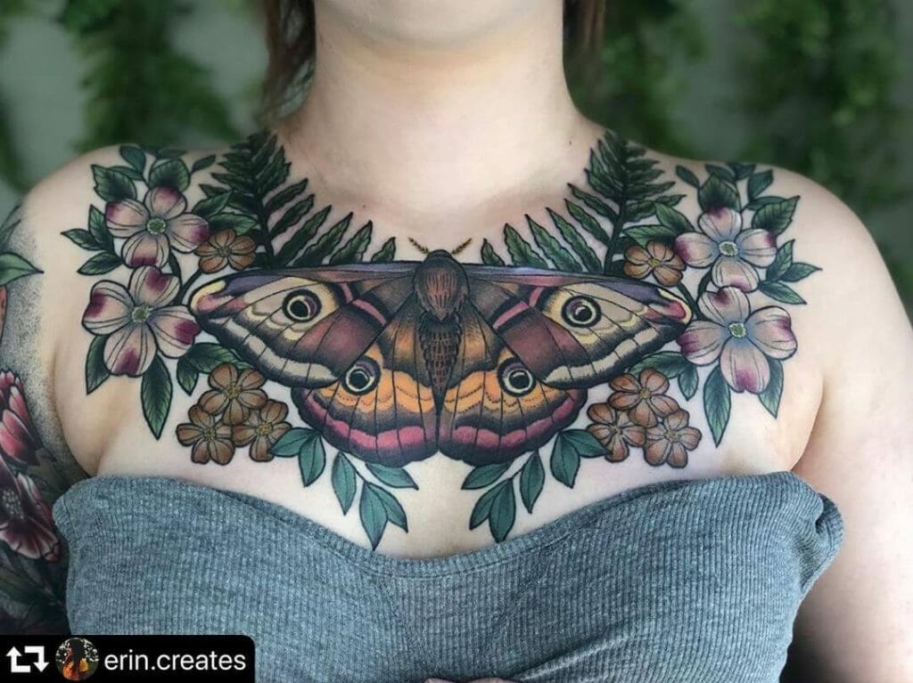 Giant Moth In Floral Chest Tattoo