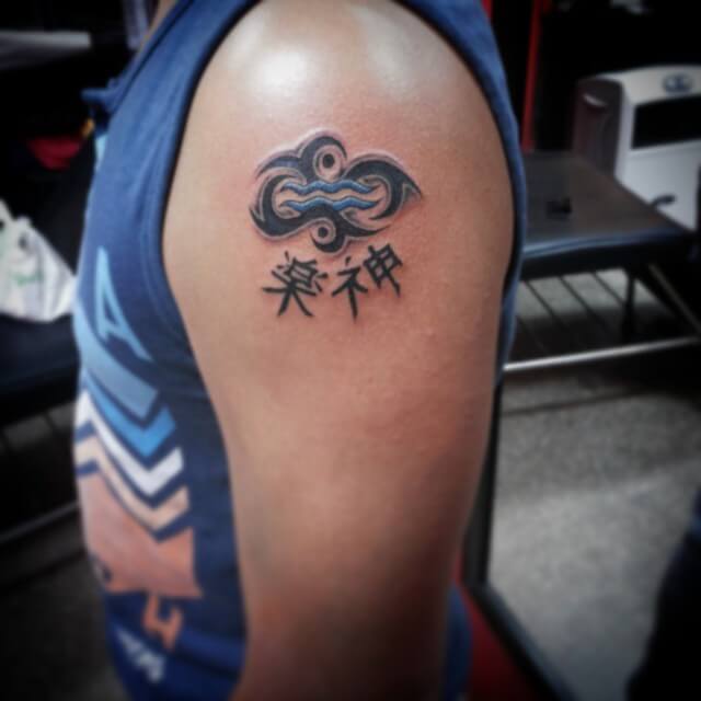 Kanji And Tribal Aquarius Tattoo