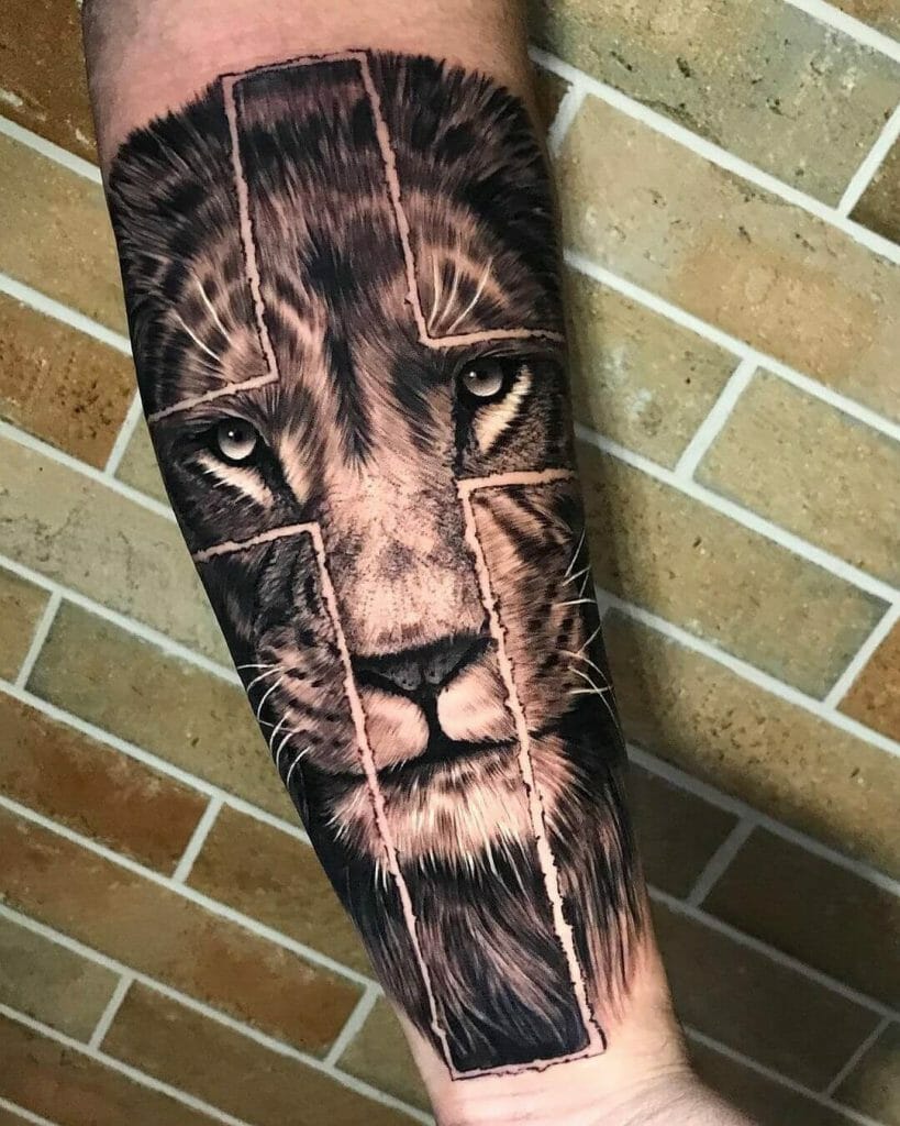 Lion looking through a Cross Tattoo