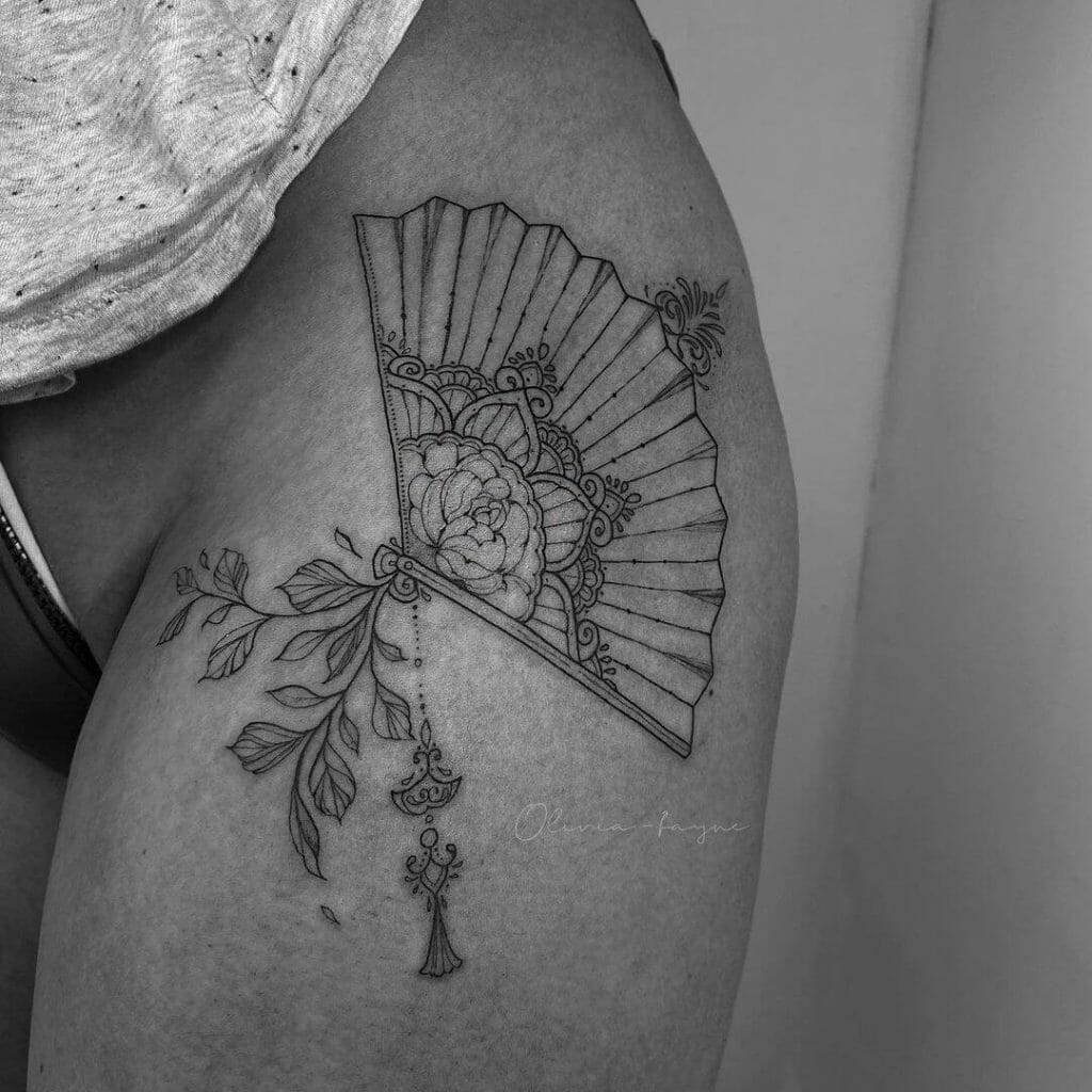 Illustrative style hand fan tattooed on the forearm
