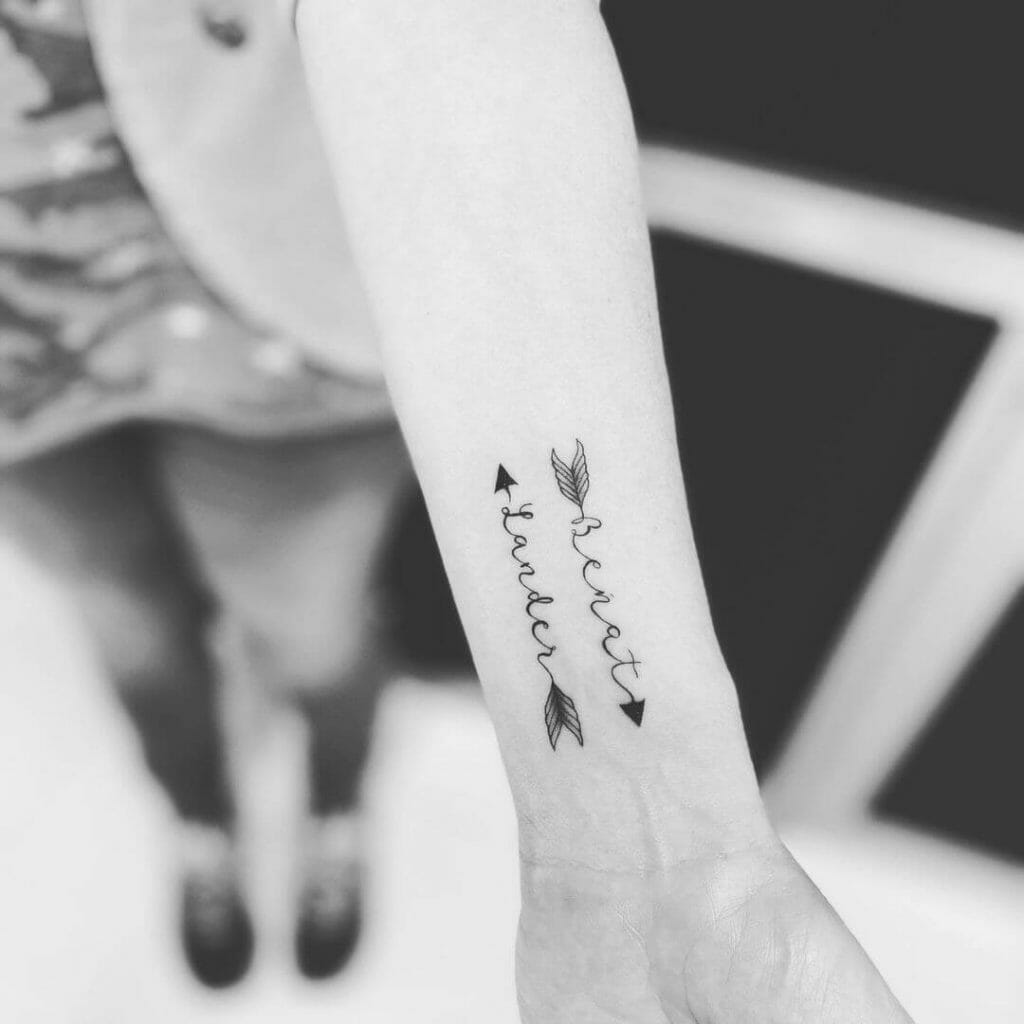Opposite Directions Arrow With Name Tattoo