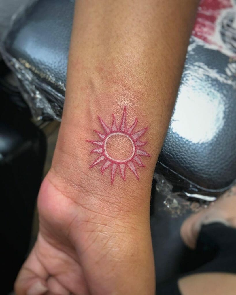 Pink Sun Tattoo Idea On Wrist