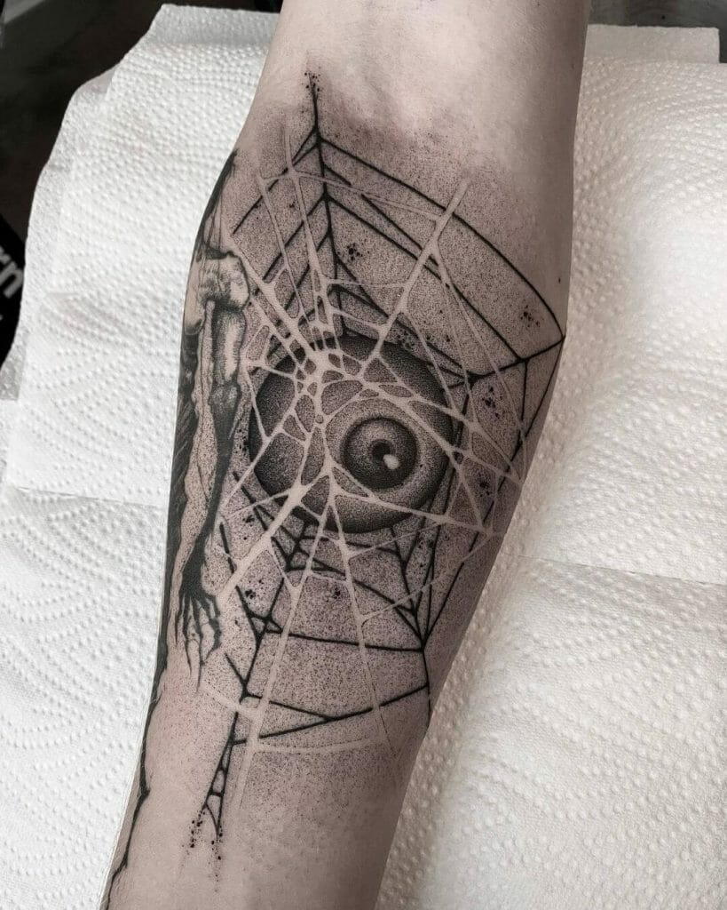 Spiderwebbed Eyeball Hand Tattoo