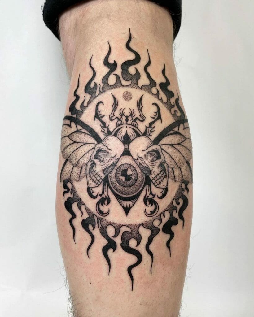 Surreal Beetle With Eyeball In Flames Tattoo