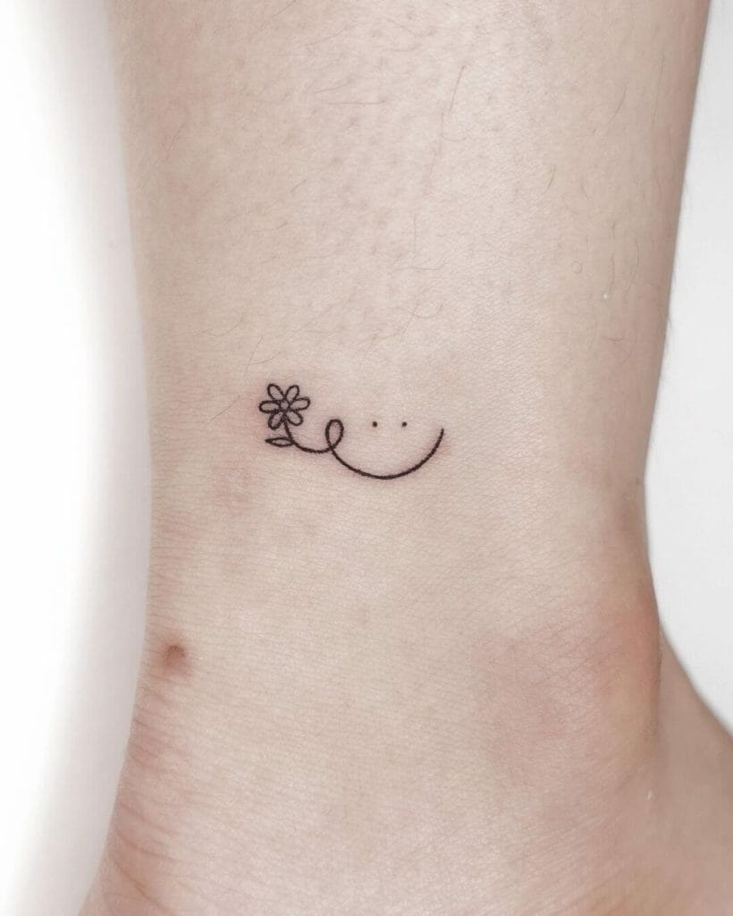 The Cute Black Ink Tiny Daisy Tattoo