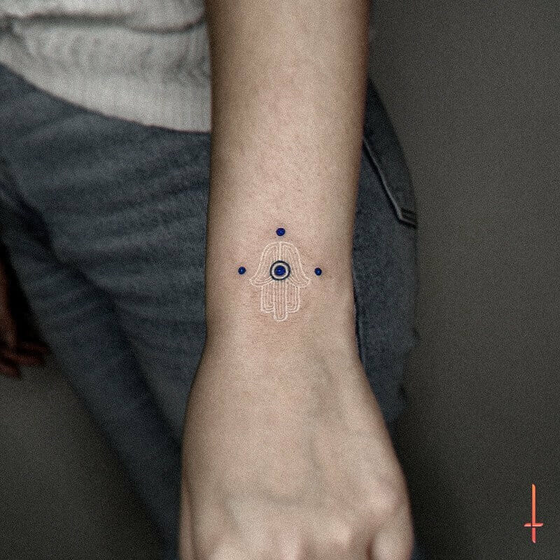 The Hand Of Fatima White Tattoo With Blue Evil Eye Design