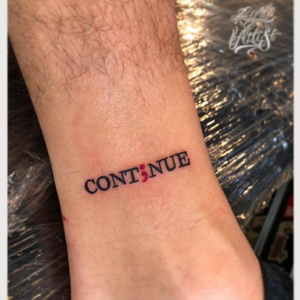 "Continue" With A Red Semicolon Tattoo