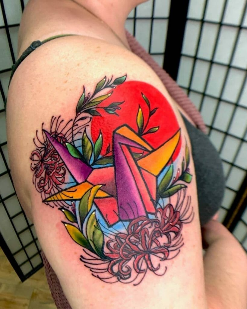 Large And Vibrant Origami Crane Tattoo With Floral Patterns