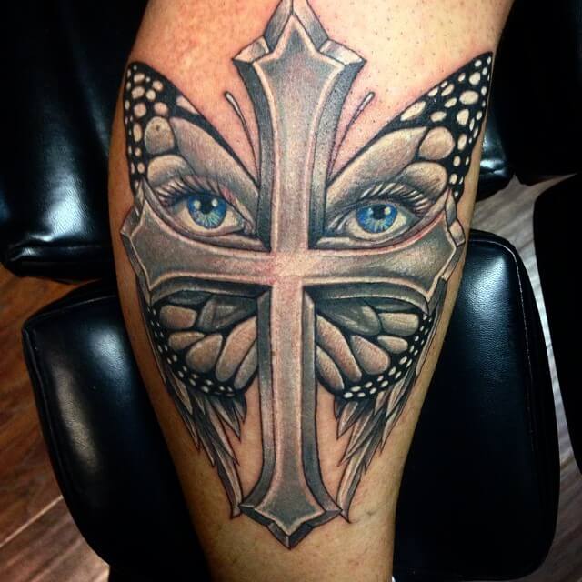 The Butterfly Eyes Cross Tattoo