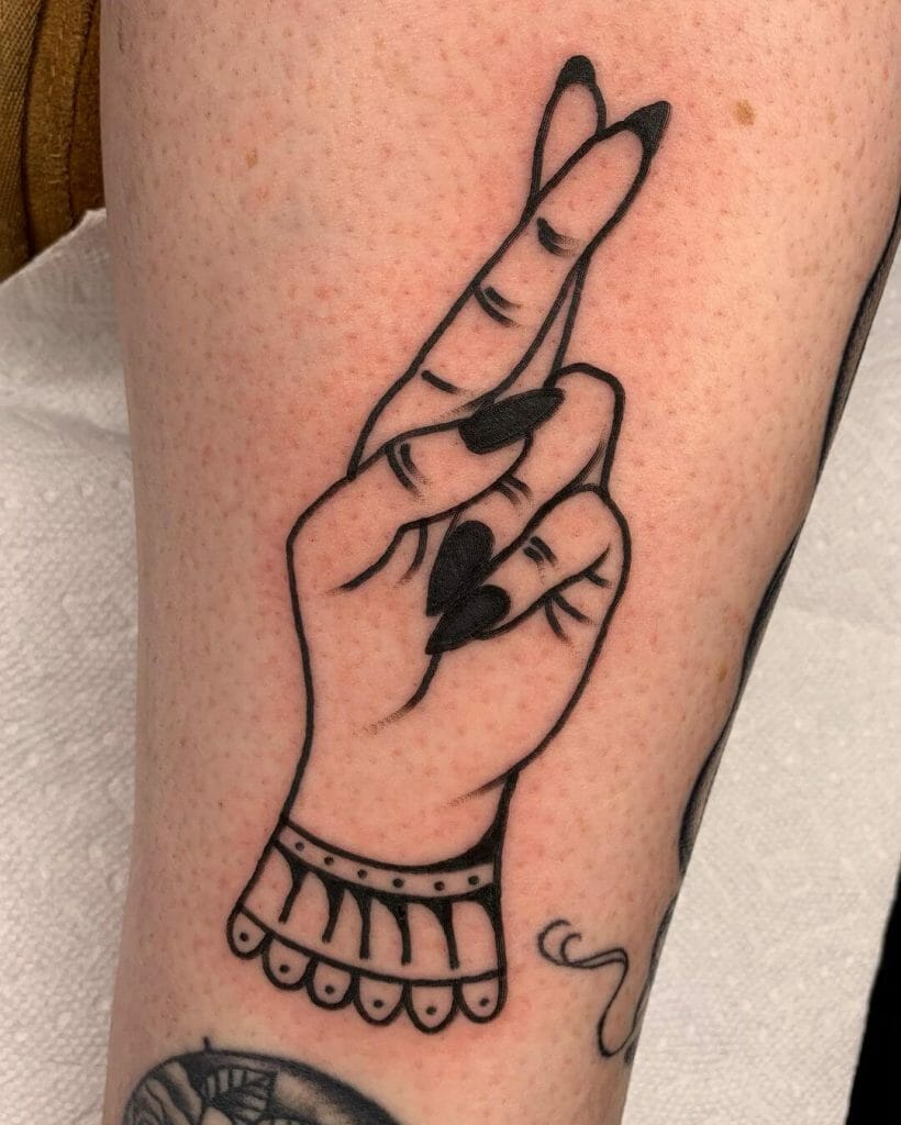 The Lady Cross Finger Tattoo