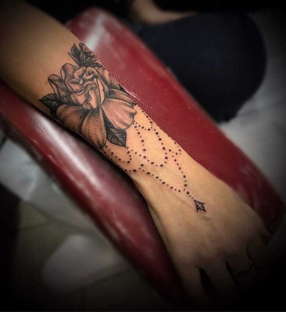 Wrist Bracelet Tattoo With A Gardenia Flower Tattoo