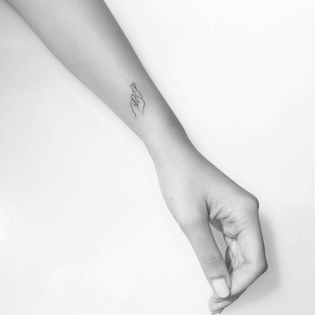 Wrist Small Fingers Crossed Tattoo