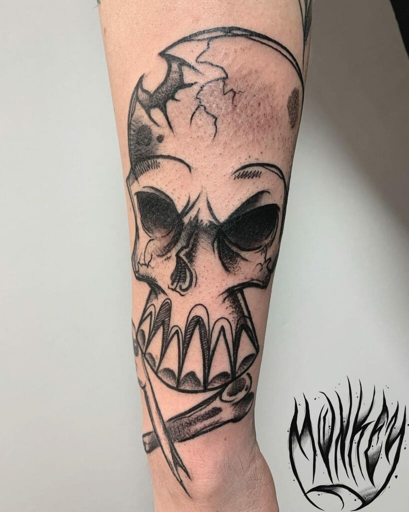 A Graffiti Skull And Crossbones Sleeve Tattoo