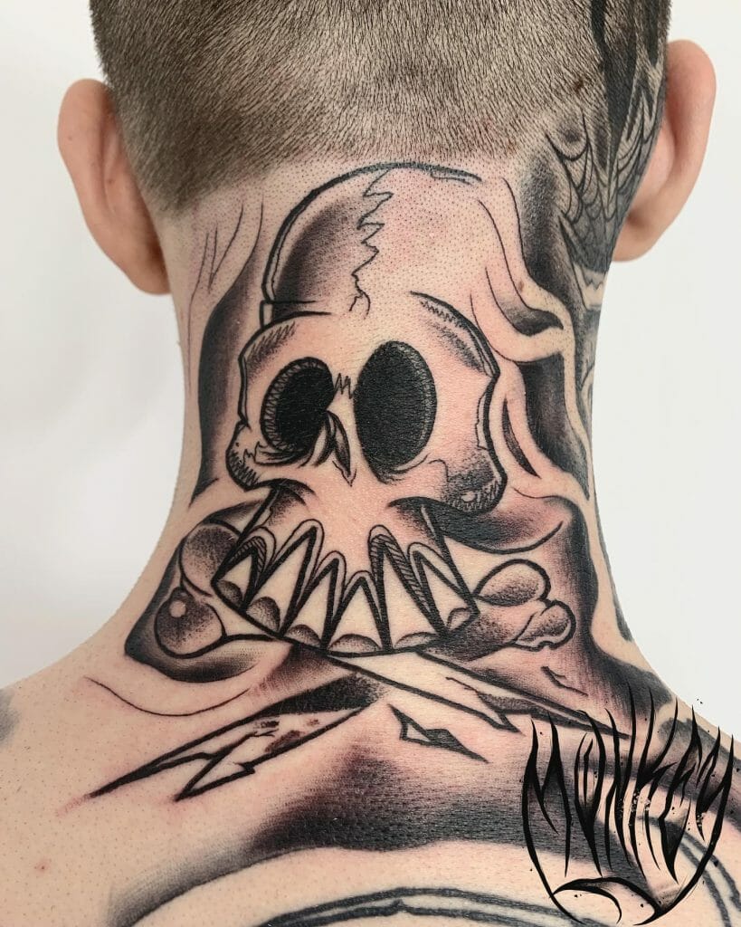 A Graffiti Style Skull And Bones Back Tattoo