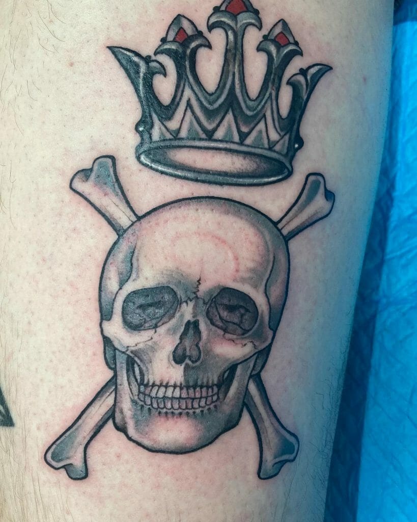 A Skull And Crossbones Tattoo With A Crown