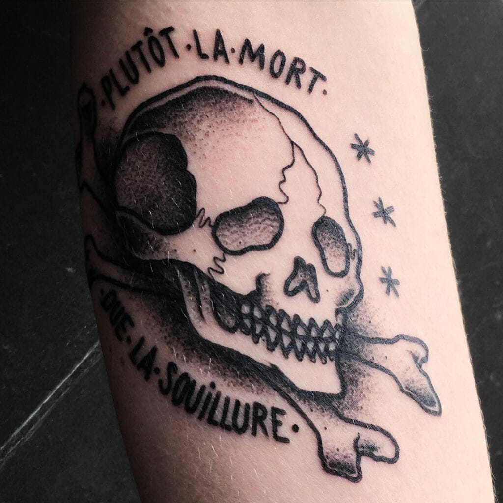 A Skull And Crossbones Tattoo With A Quote