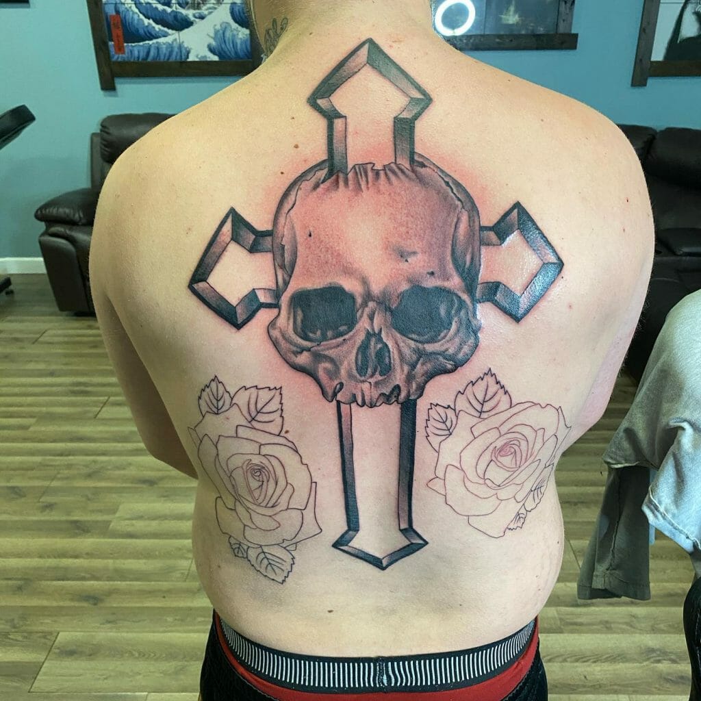 A Skull Tattoo With An Impaled Cross