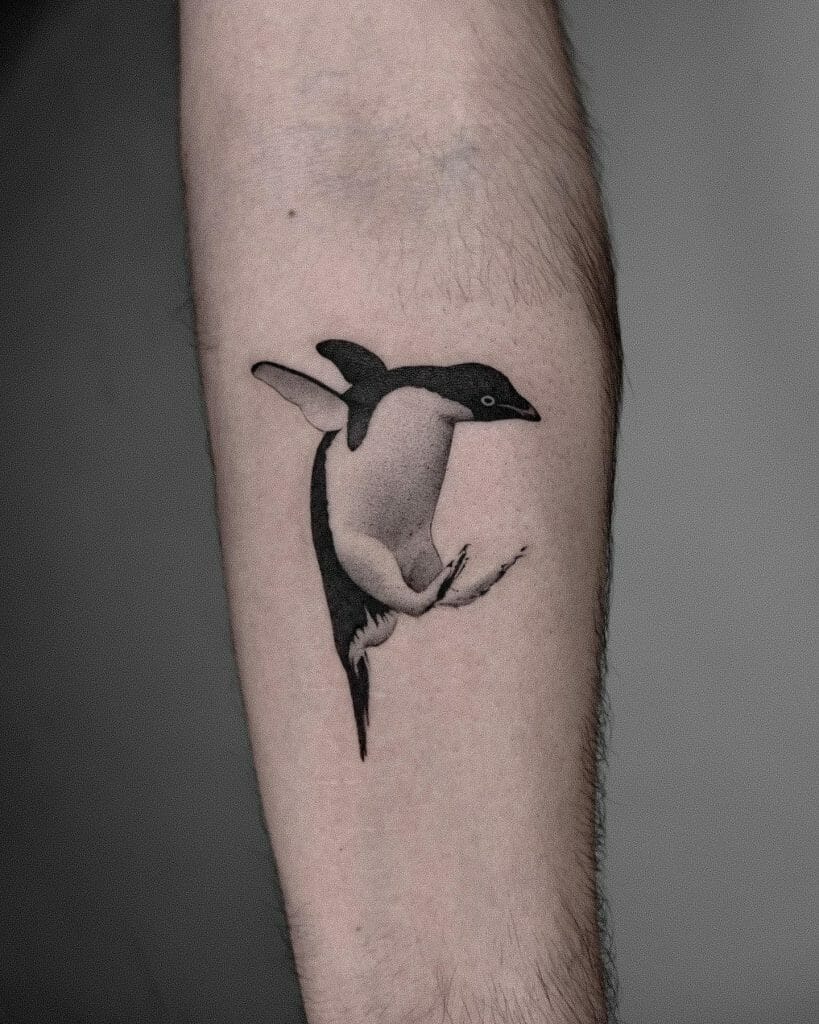 Baby Penguin Tattoo In A Flying Mood
