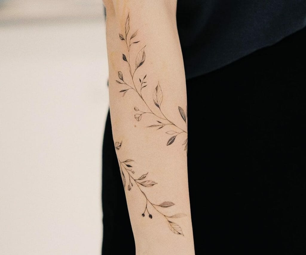 forearm rose vine tattoo