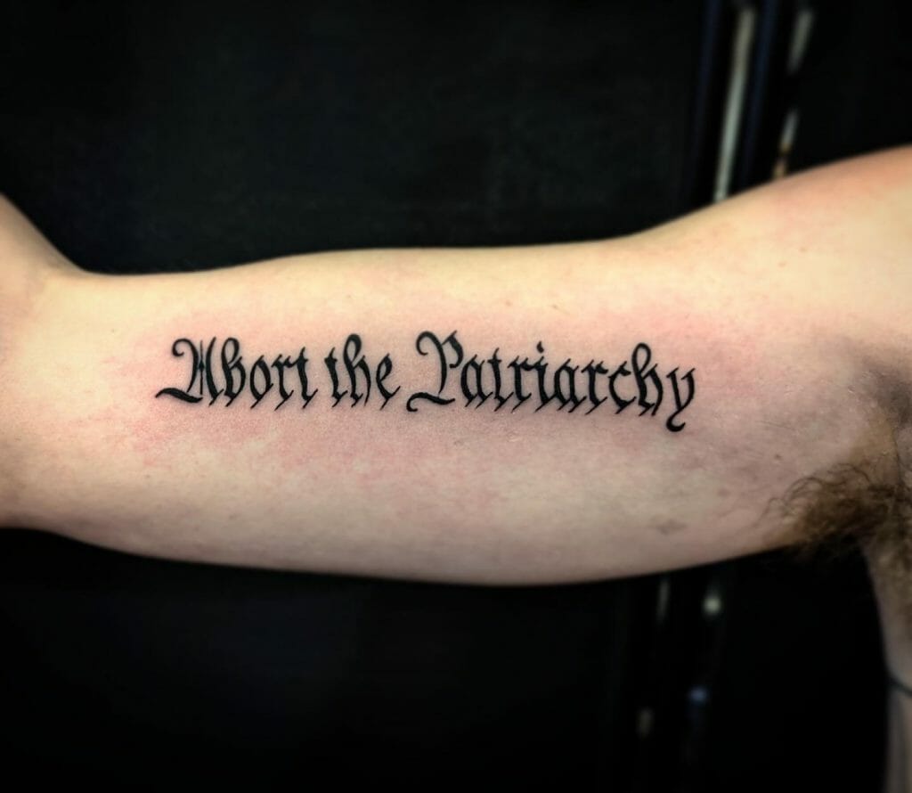 Bold Arm Lettering Tattoo