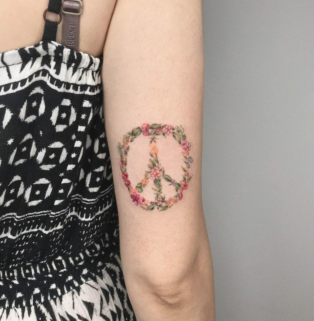 Floral Symbol Of Peace Tattoo On Arm