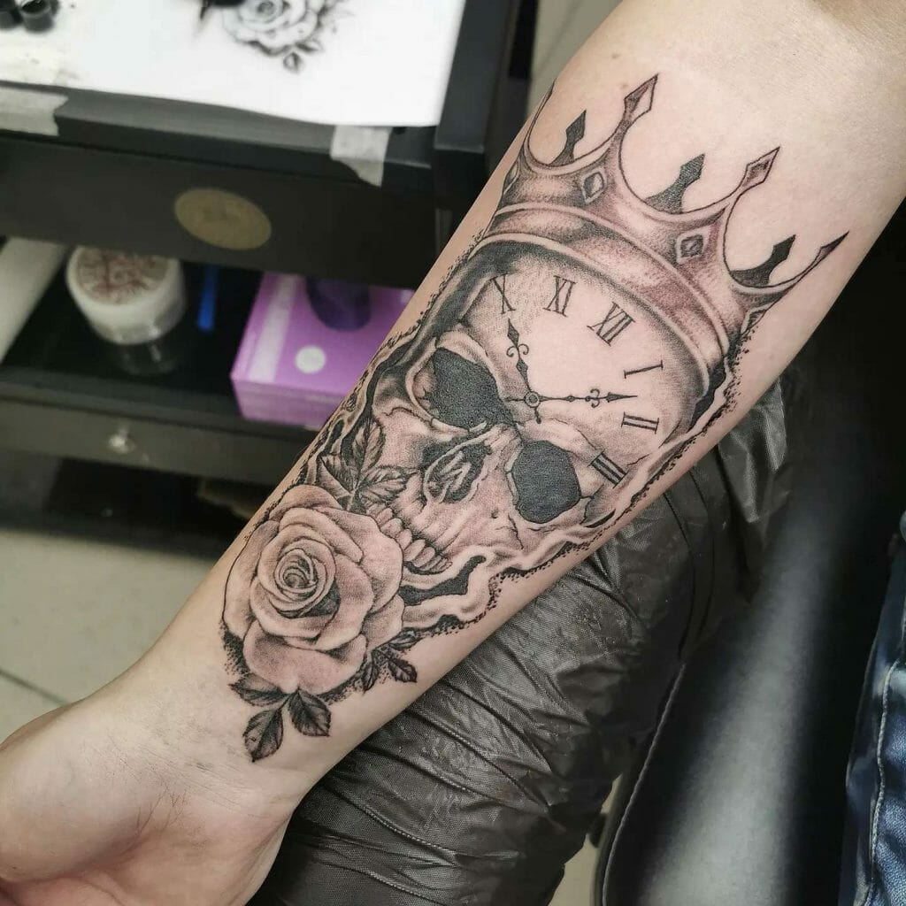 Half Sleeve Tattoo Of Skull And Crown With A Clock And A Rose