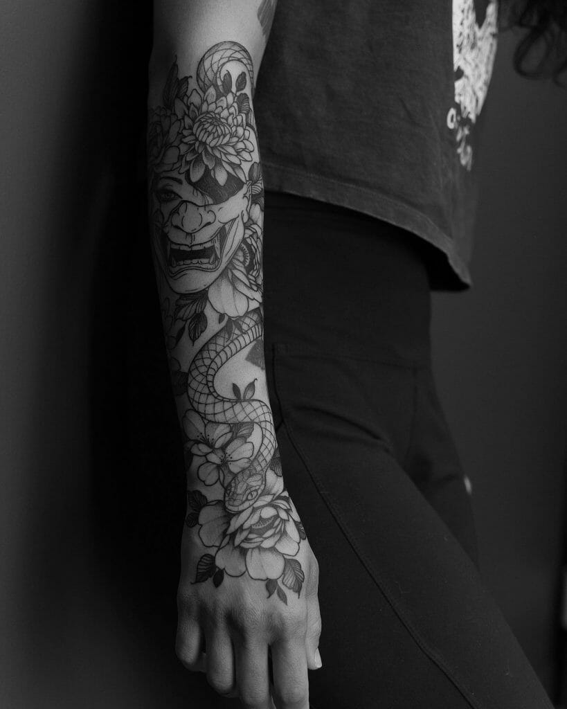 Half sleeve snake tattoo