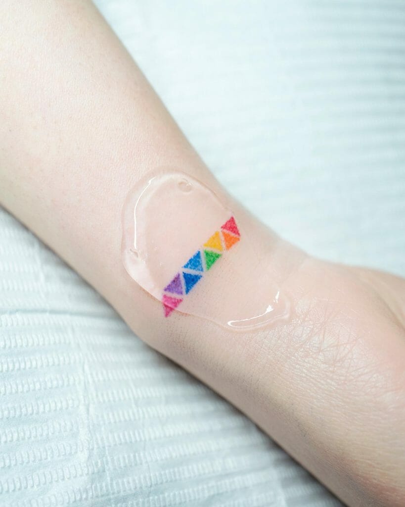 Hand Poke Rainbow Tattoo Design For Pride Month
