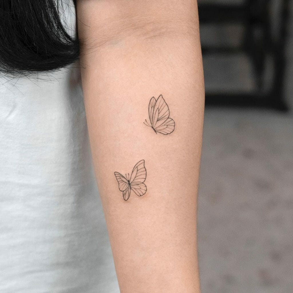 Minimalistic Black Butterfly Tattoo