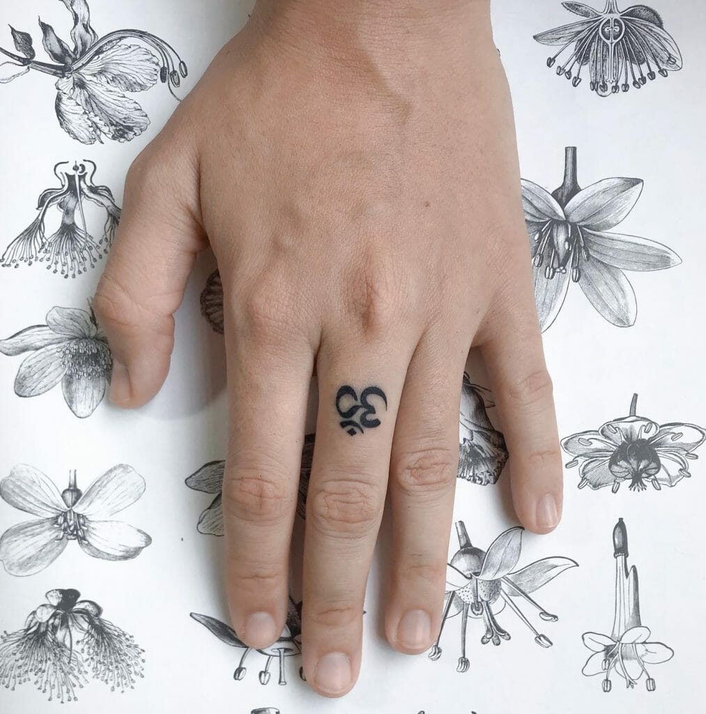 Om Finger Tattoo