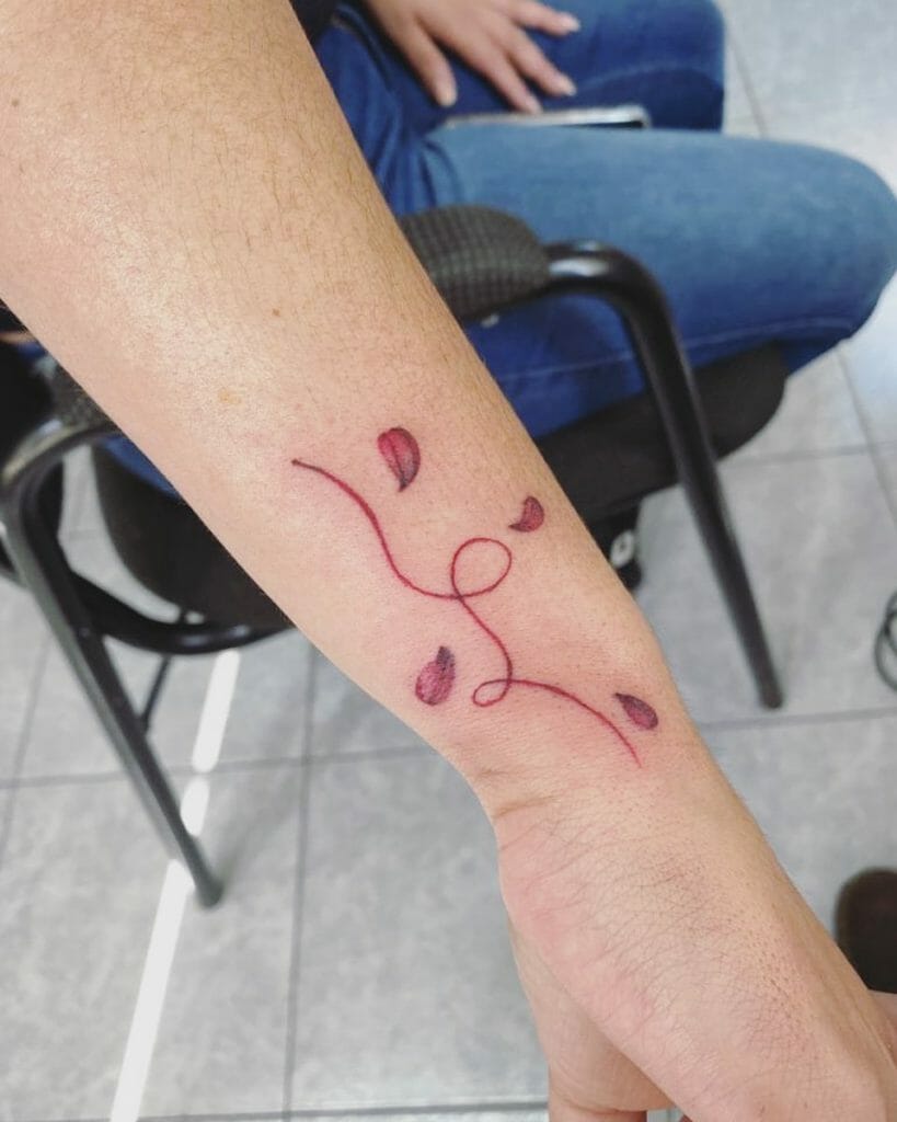 Red Thread Of Fate Tattoos With Petals