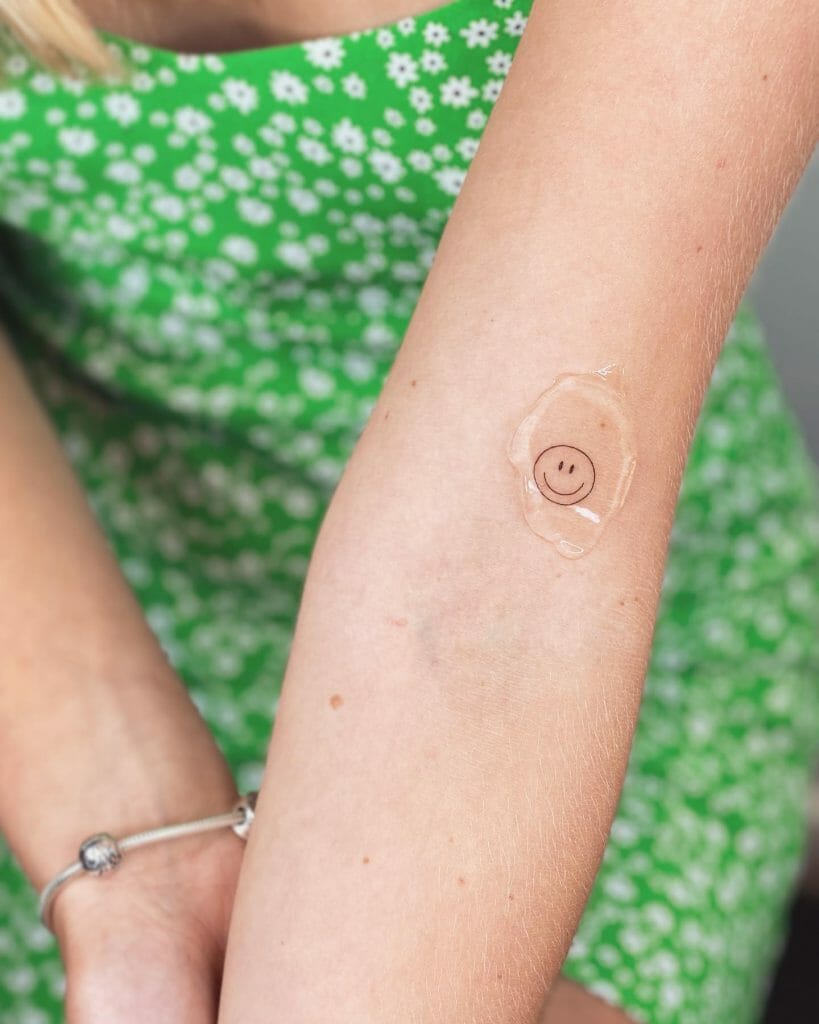Single Smiley Face Tattoo On Arm