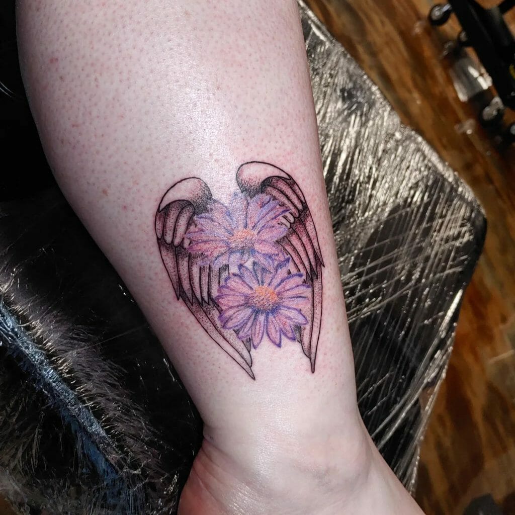 Small Angel Wing Tattoo With Floral Motifs