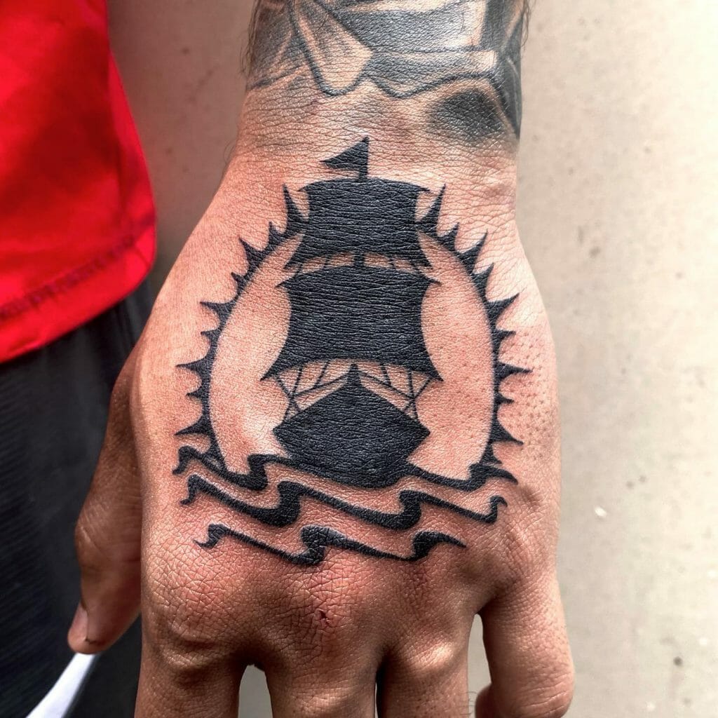Small Pirate Ship Tattoo On Hand