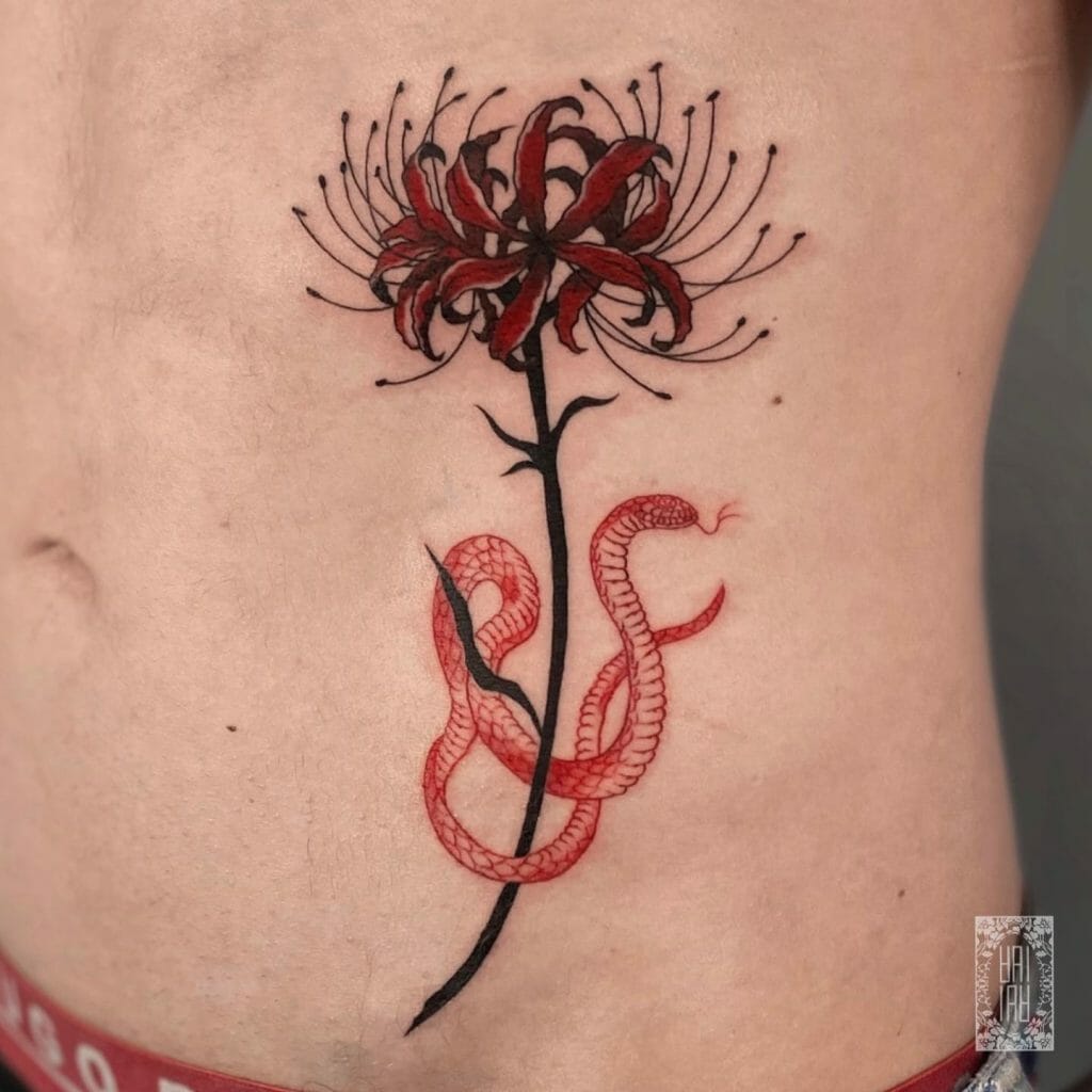 Snake And Flower Rib Tattoo