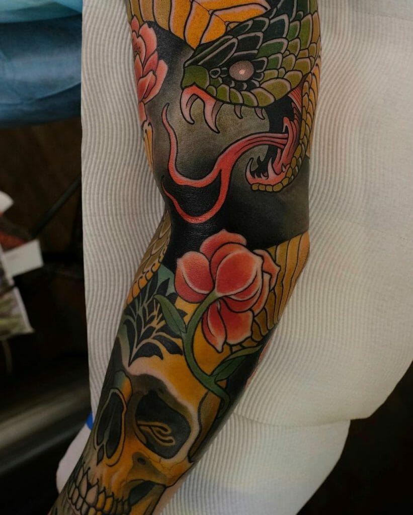 Snake And Skull Sleeve Tattoo