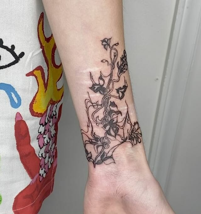 Tangled Flower Vine Tattoo on Arm