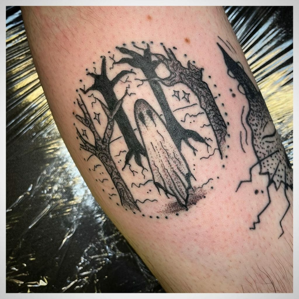 Tattoo Of A Tiny Ghost Haunting Forests