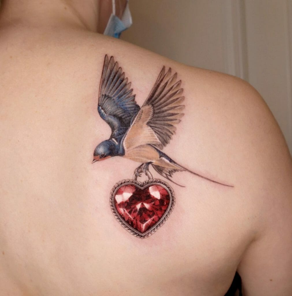 Traditional Swallow Bird Tattoo With A Heart