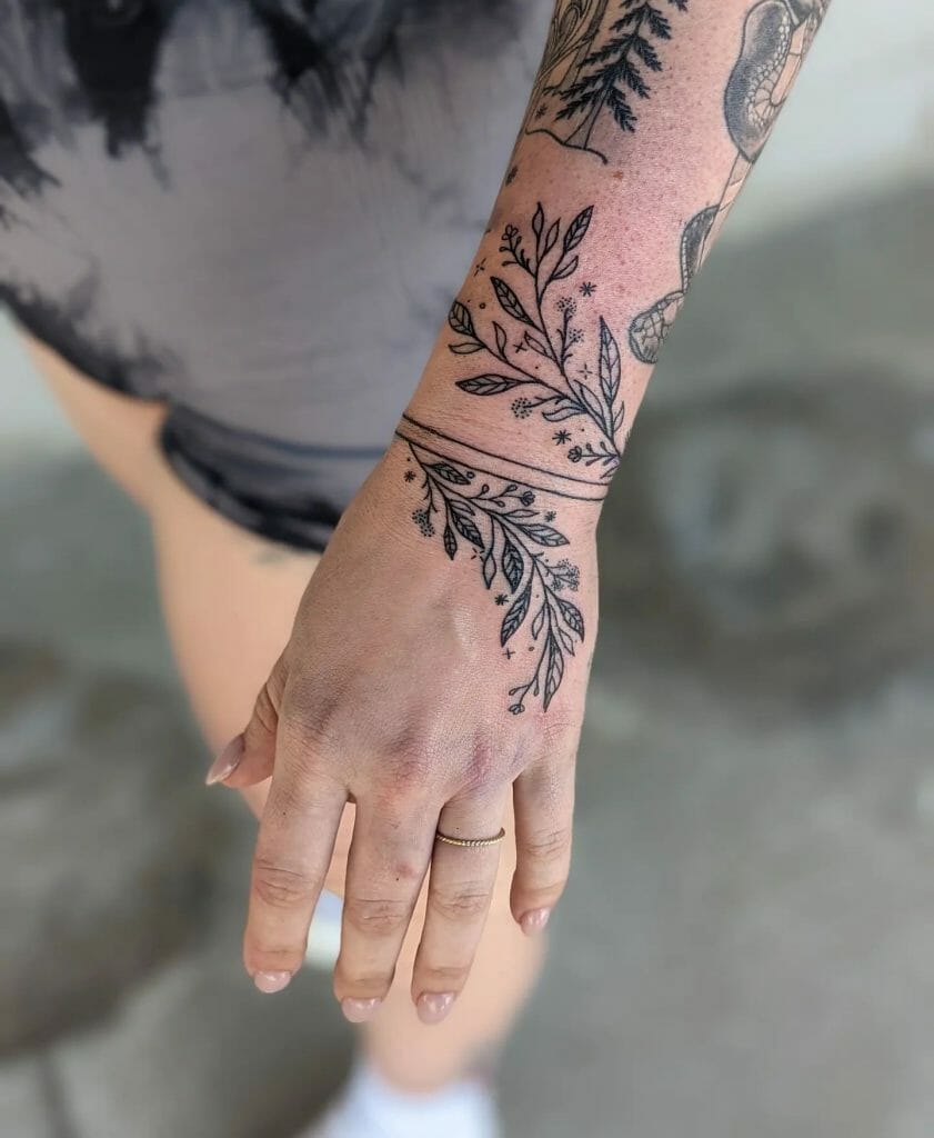 Vine Tattoo Around The Wrist And Arm