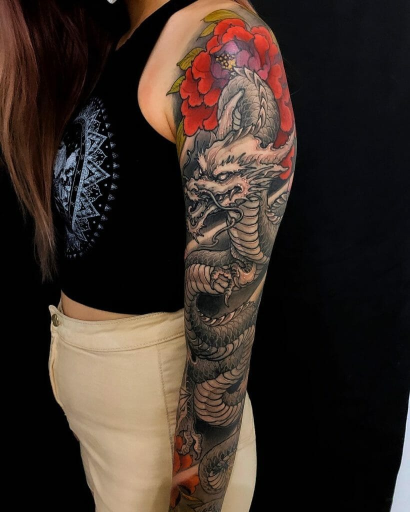 A Detailed Dragon Sleeve Tattoo For Women
