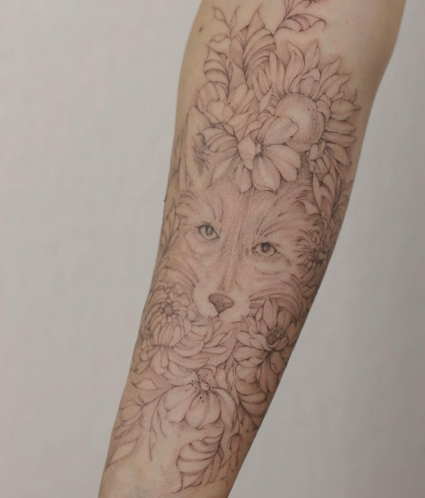 A Floral And Wolf Sleeve Tattoo For Women