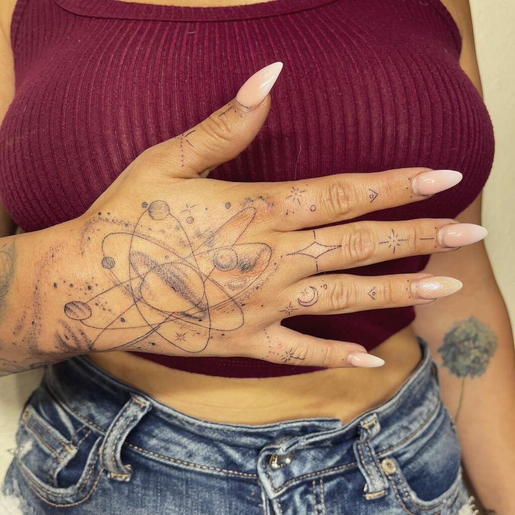 A Galaxy Hand And Finger Tattoo