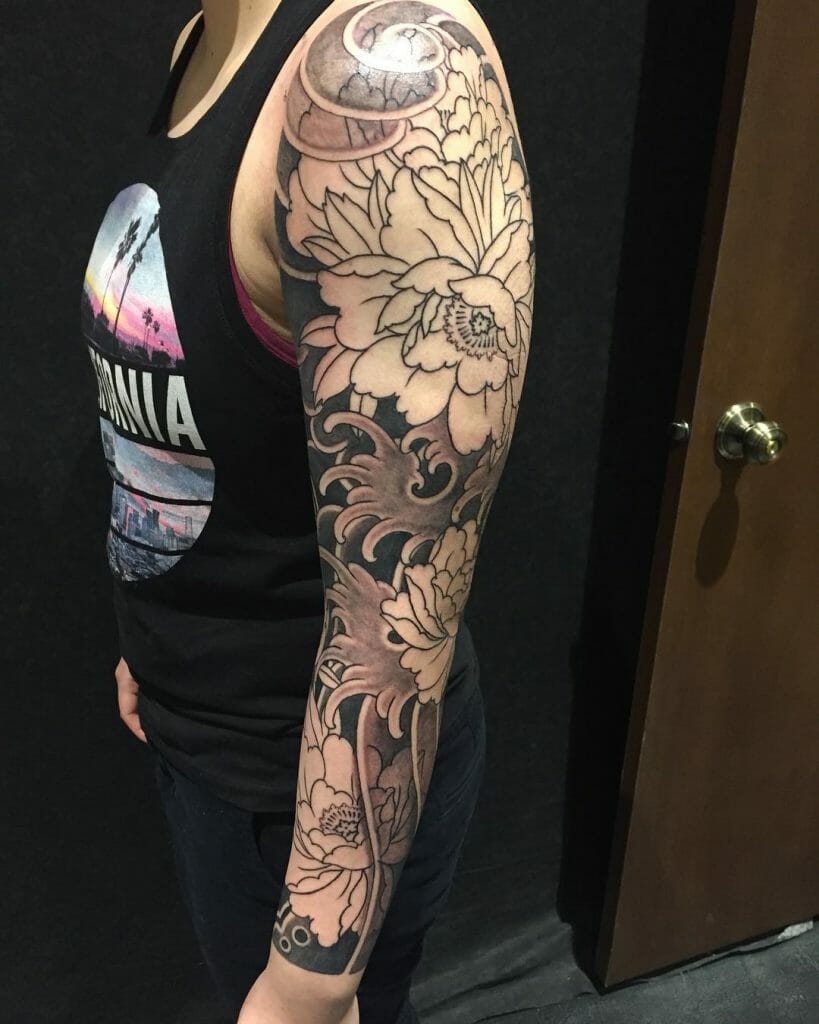 An Abstract Floral Sleeve Tattoo For Women