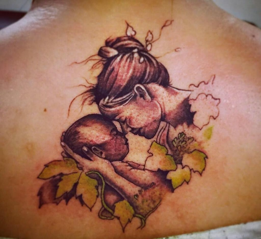 Back Tattoo Of A Mother And Child