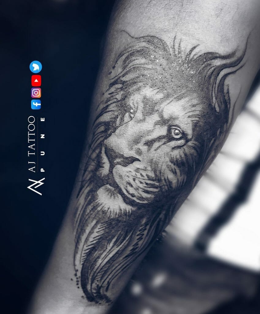 Beautiful Black Lion Face Tattoo On Forearm