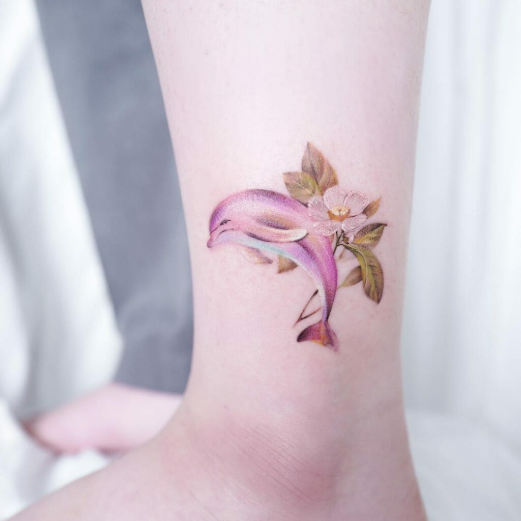 Beautiful Dolphin Tattoo With Floral Motifs For Women