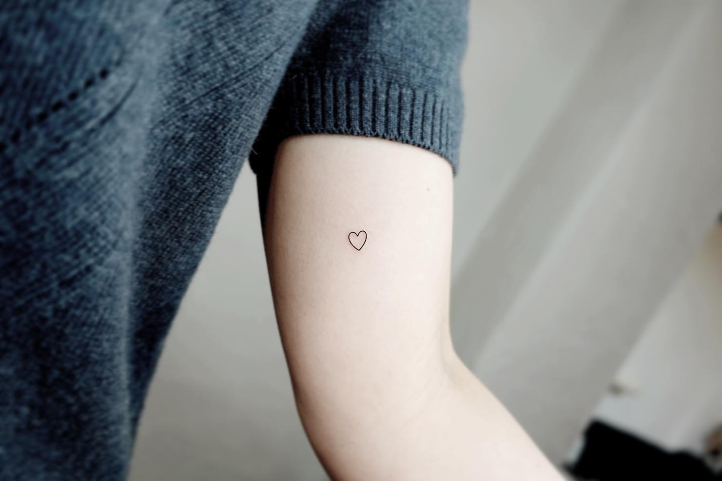 Matching airplane and heart tattoo for best friends.